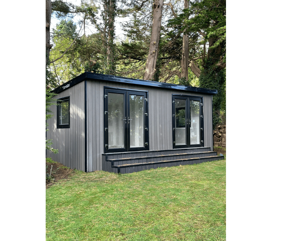 Modern dual office studio with large glass doors in a lush garden setting.